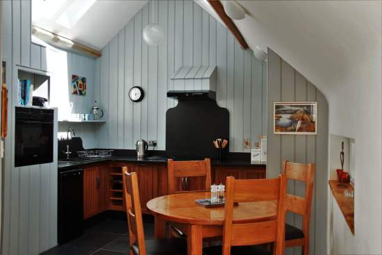 Light and bright upstairs kitchen and dinning area, with views over an old millpond